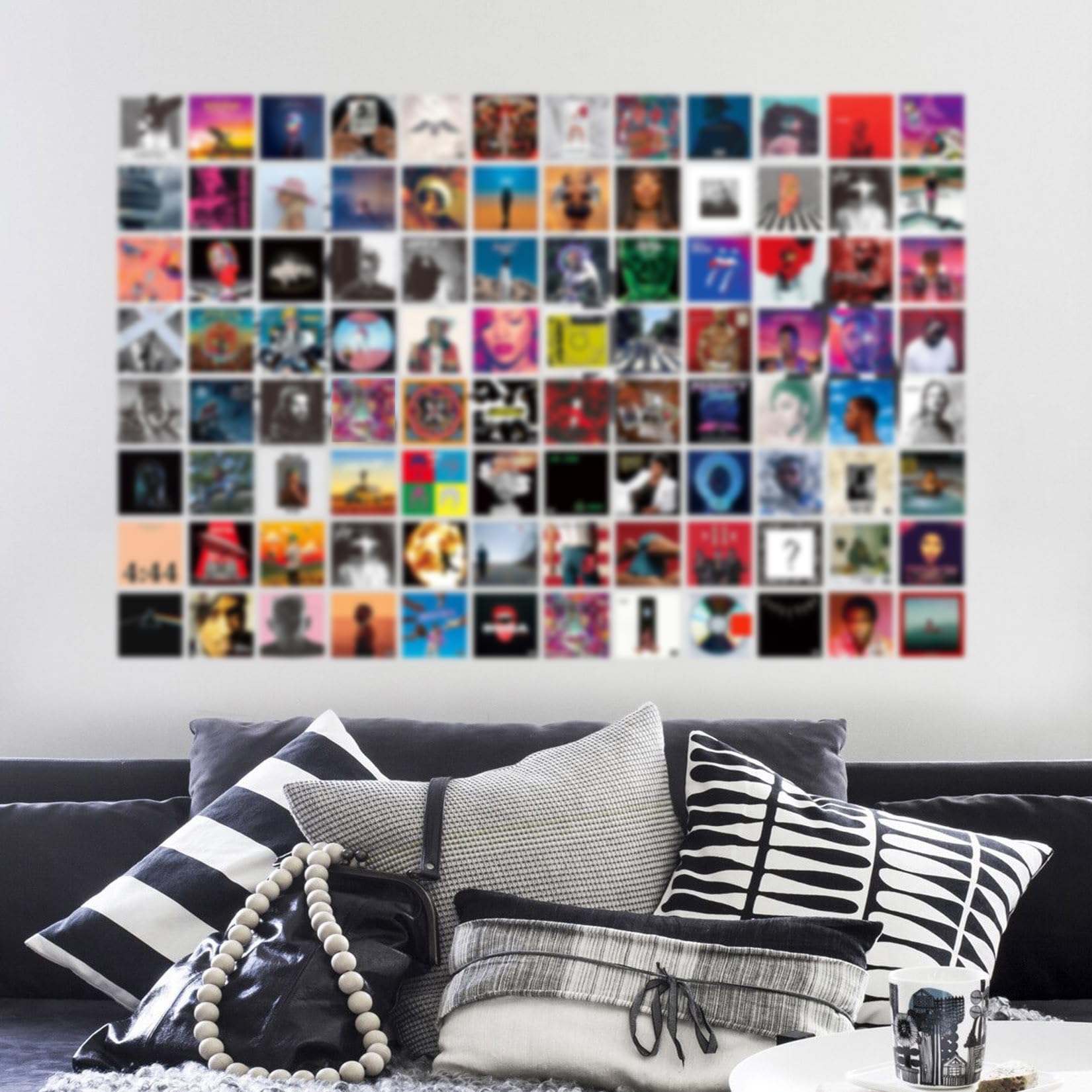 A ART·ZONE music posters reflect favorite artists and genres in a bedroom