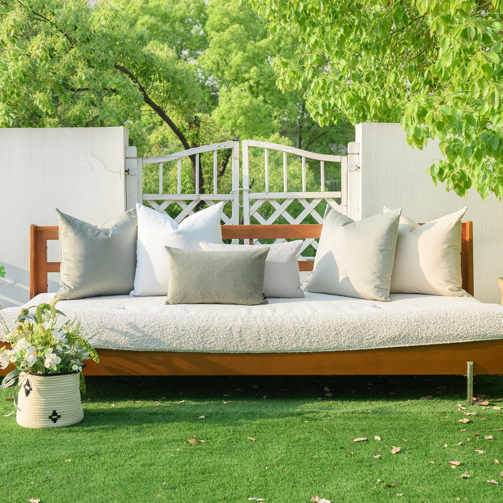 A Moment living room and patio setup featuring green pillow covers