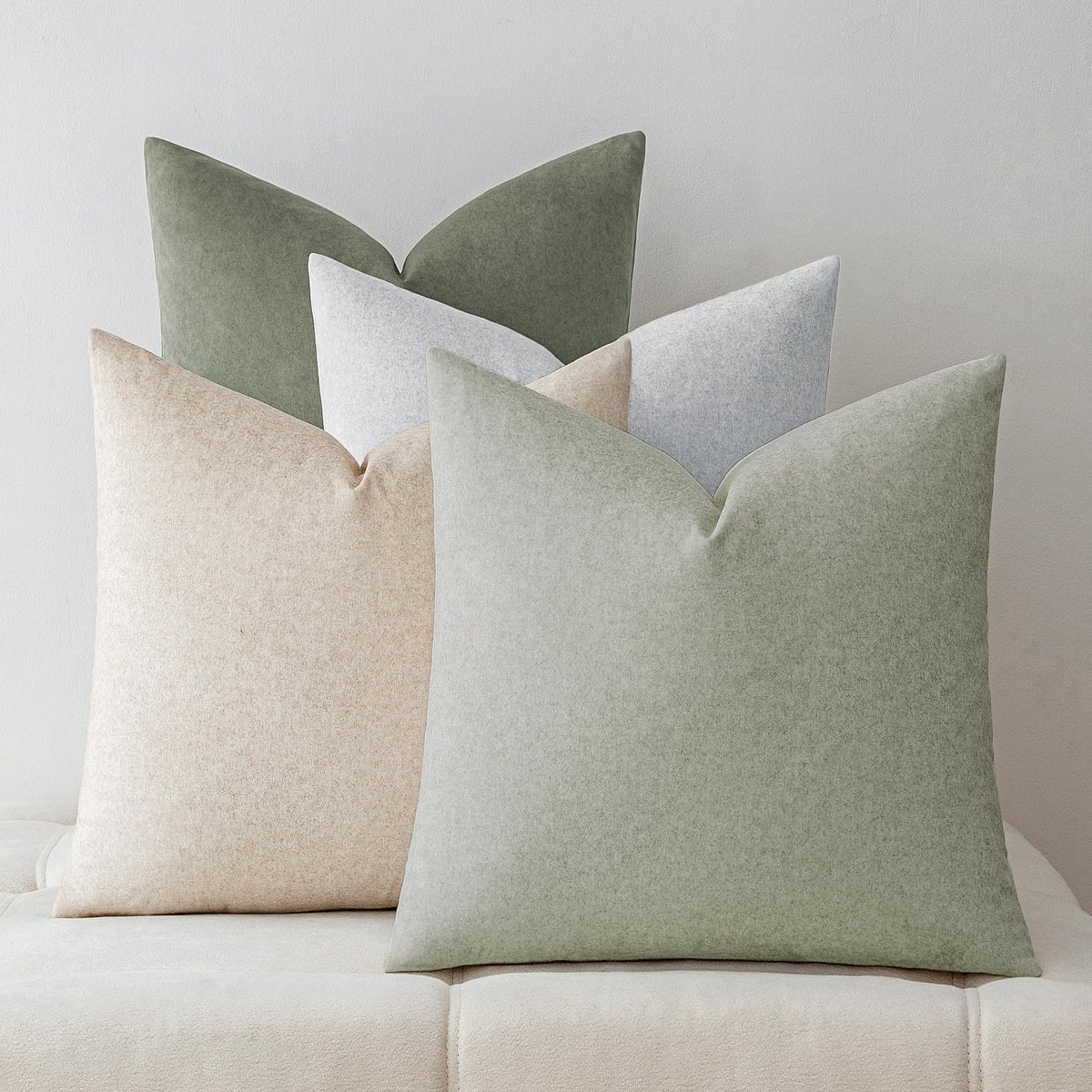 A Moment waterproof green pillow cover in a 4-pack close-up showing stain resistance