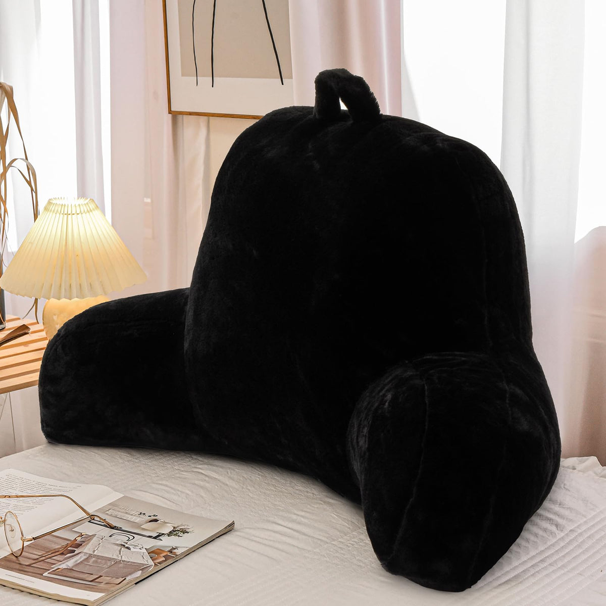 A Nice Night faux fur reading pillow in black, front view for upright reading.