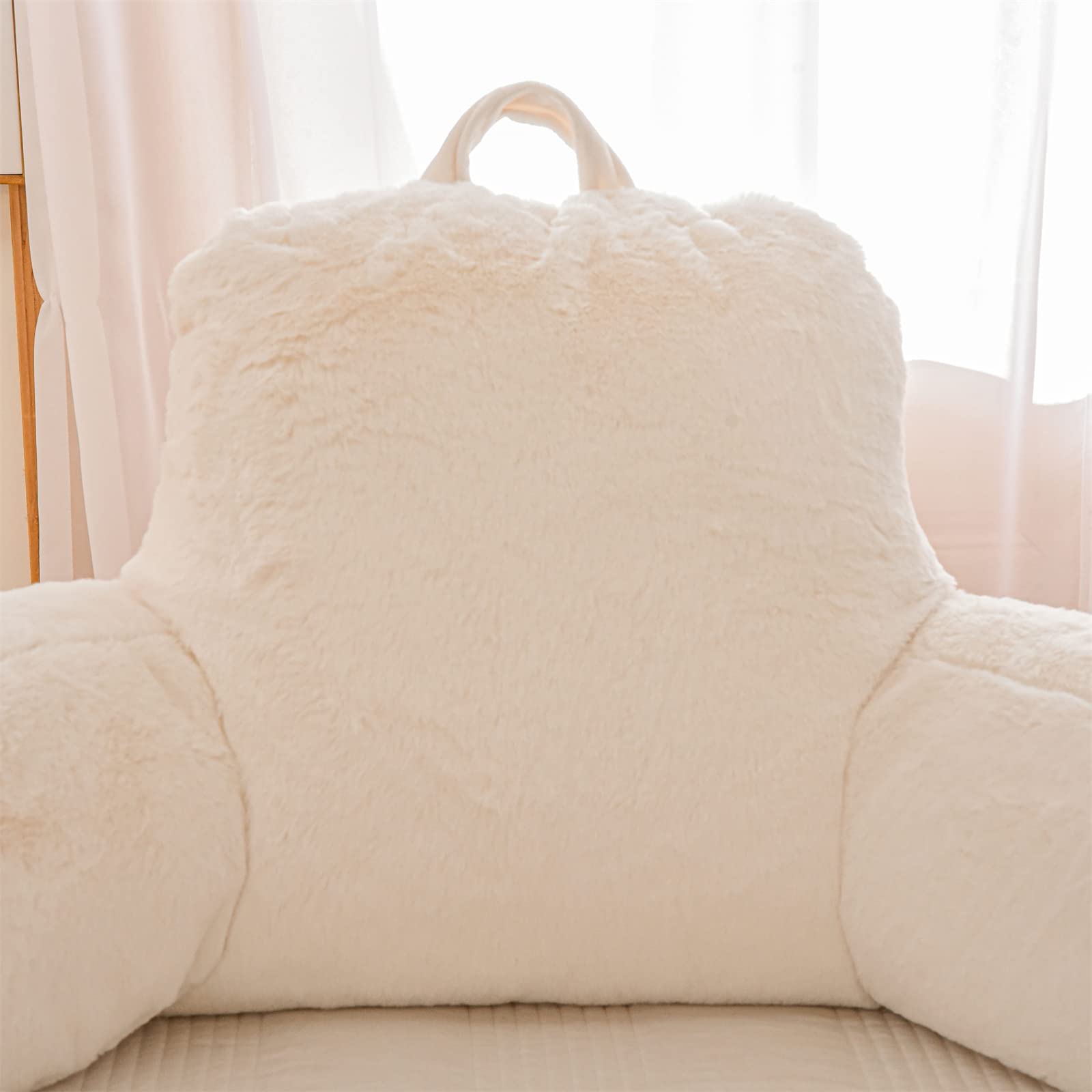 A Nice Night portable reading pillow with carrying handle for easy transport.