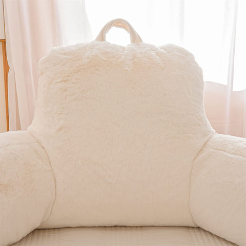 A Nice Night portable reading pillow with carrying handle for easy transport.