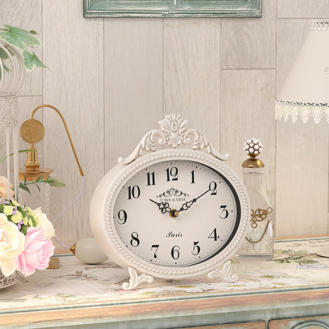 Abdurey metal frame antique white finish clock adds farmhouse elegance.