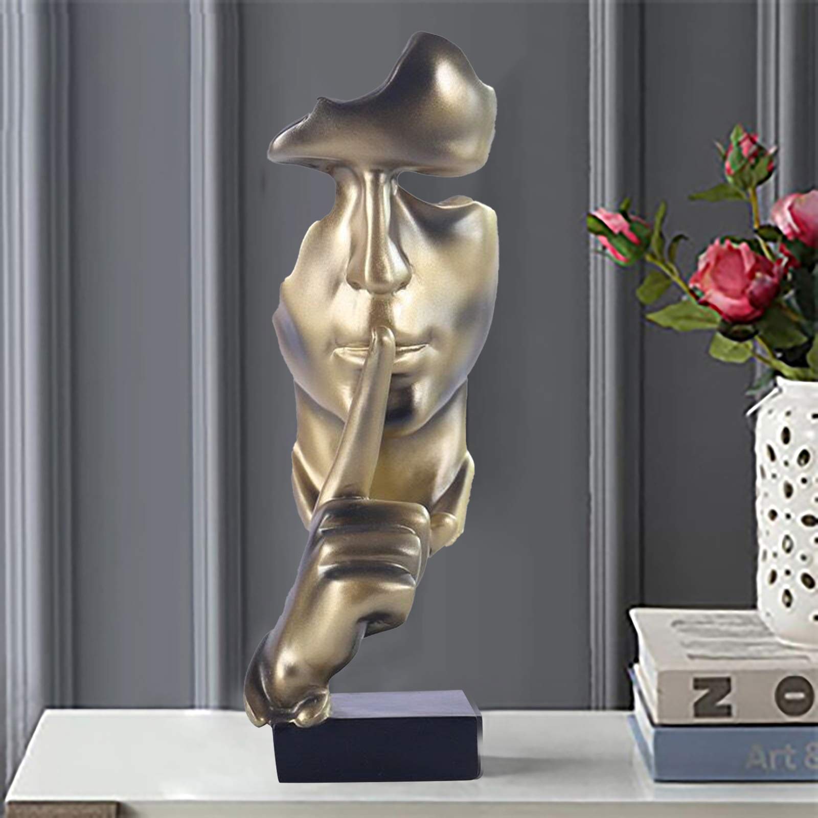aboxoo Modern resin sculpture provides a sleek, contemporary accent.