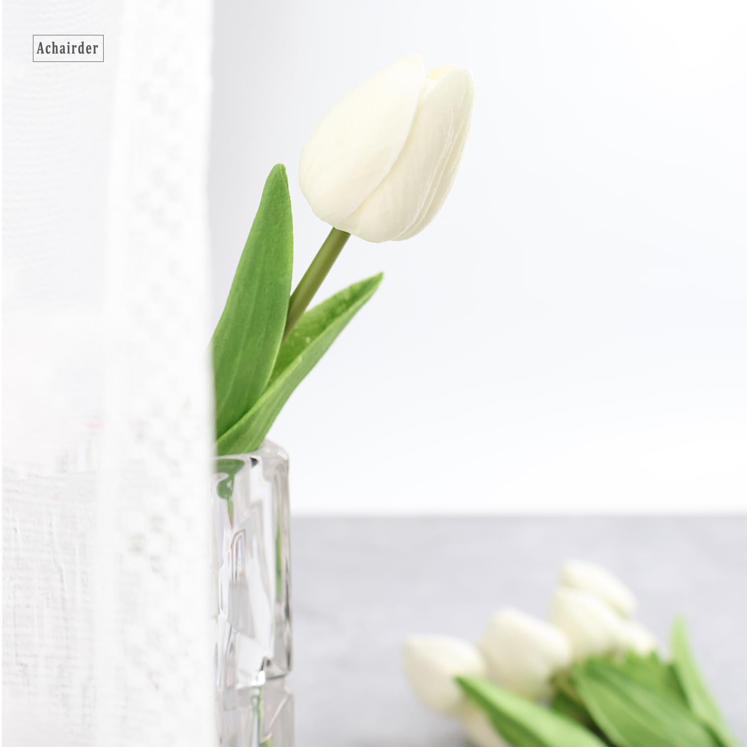 Achairder white tulips enhance wreaths and party decor with realism.