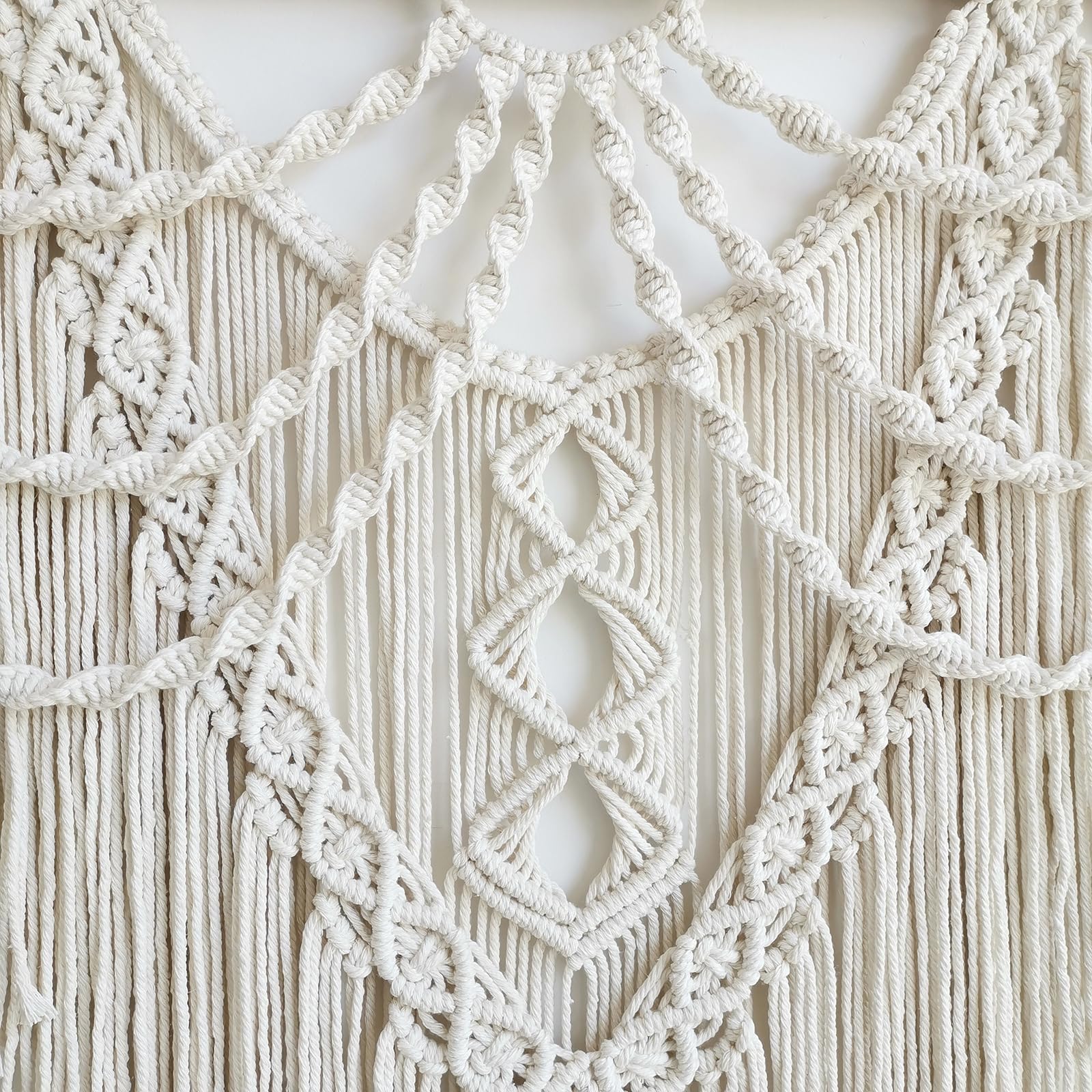 Achart macrame bed headboard idea introduces cozy, artisanal vibes