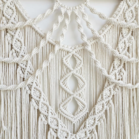 Achart macrame bed headboard idea introduces cozy, artisanal vibes