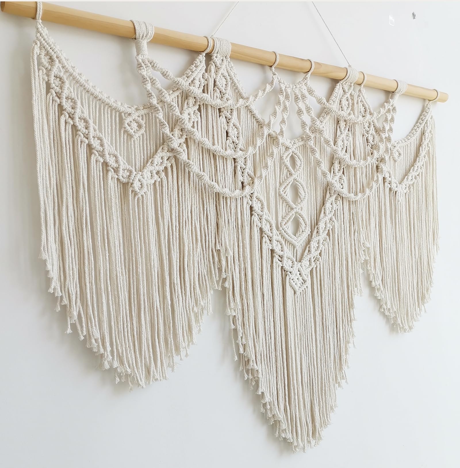 Achart macrame three-piece assembly offers flexible hanging options