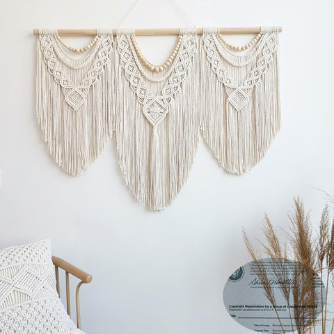 Achart boho wall hanging placed above a sofa creates a focal point