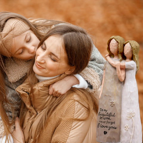 AcowSpt mom figurine side view embracing daughter highlighting warm gift expression