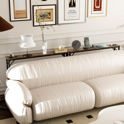 Aduanbang console table behind couch storing remotes and lamps