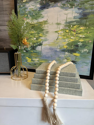 Closeup of ADUN Stationery decorative books showing wooden beaded tassel