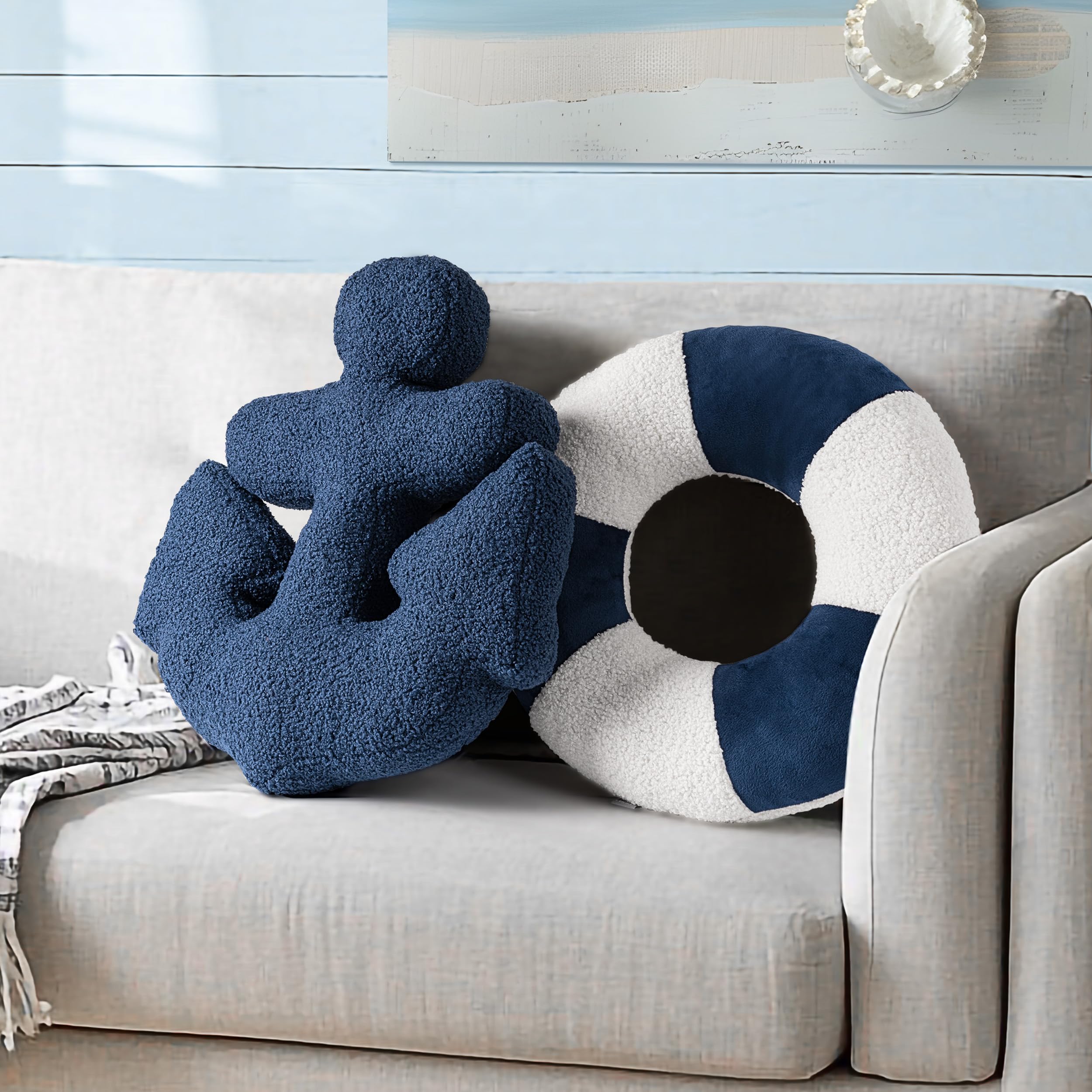 AELS anchor lifebuoy pillow in navy and white on a sofa, coastal decor