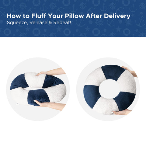 AELS lifebuoy pillow on a bed with navy accents