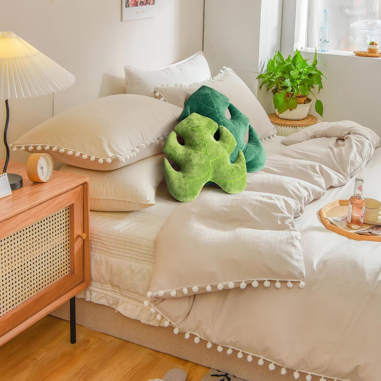 AELS Monstera Deliciosa cushions enhance living room decor with tropical flair.