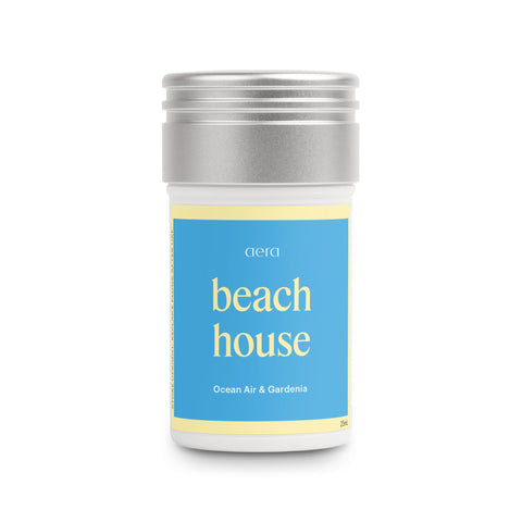 Aera Beach House ocean air bottle releases a fresh coastal scent.