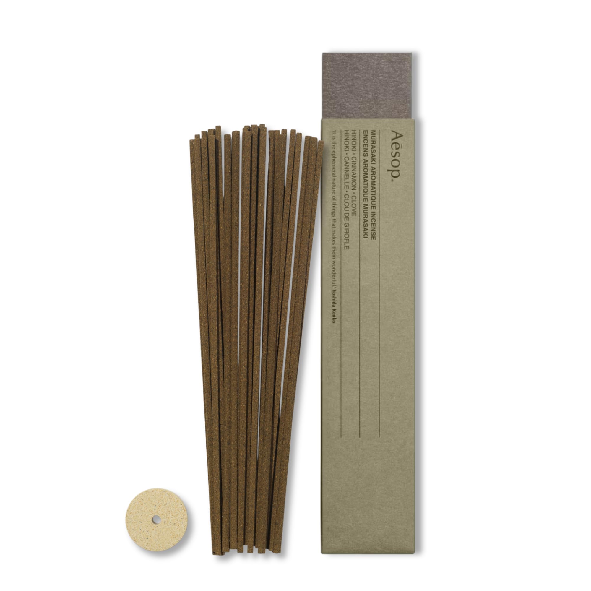 Aesop Murasaki incense sticks stacked, ready to infuse a woody-spicy ambiance.