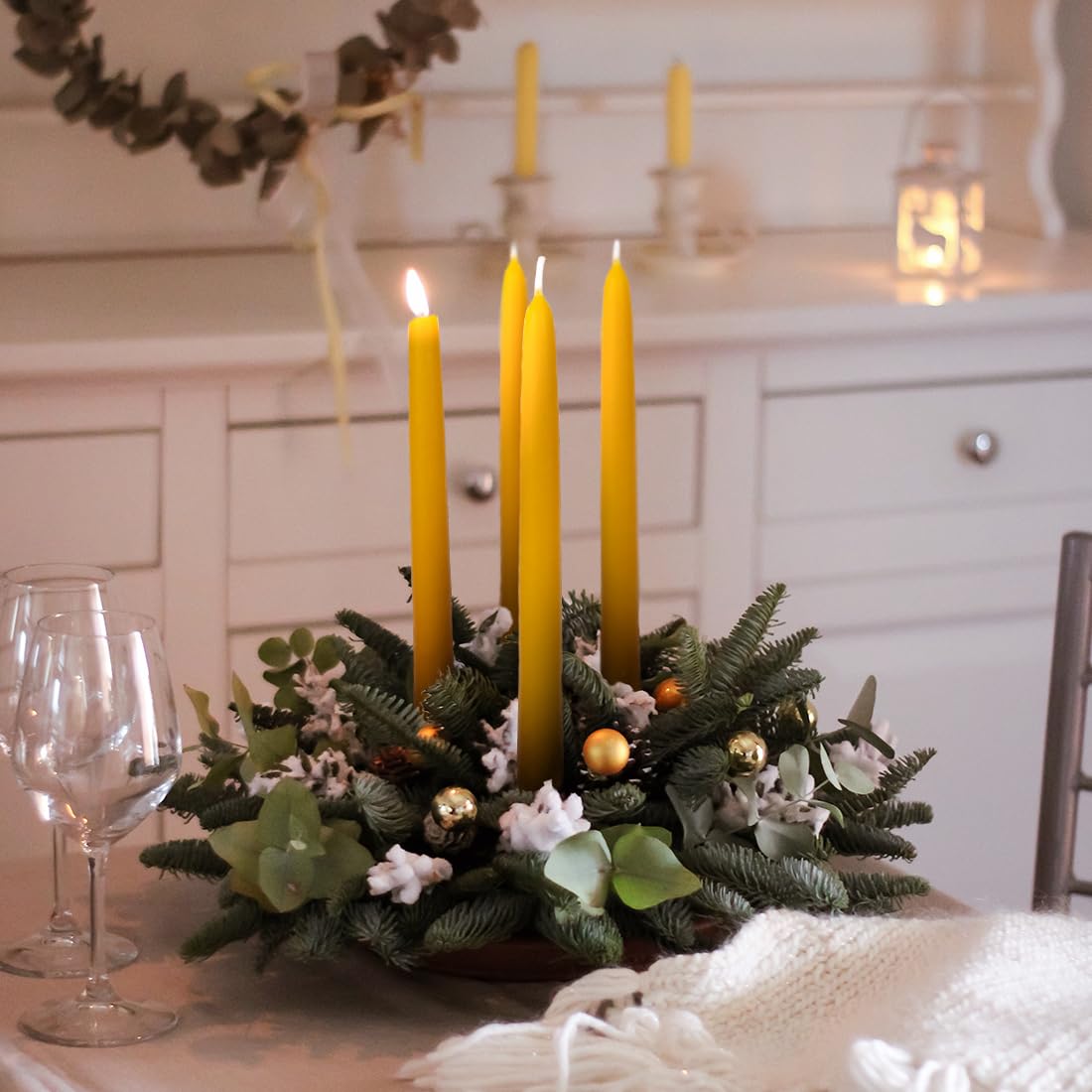 Handmade beeswax tapers from AGLARY deliver a natural glow with minimal soot.