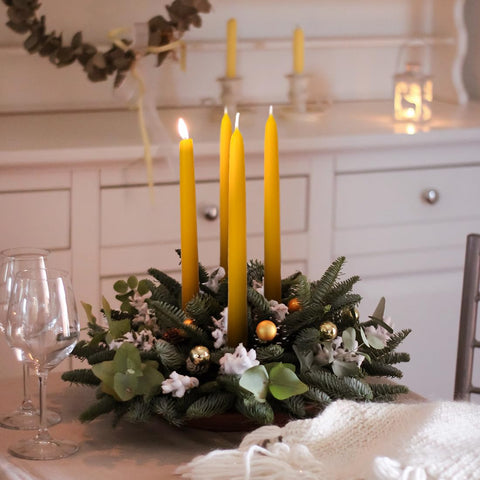 Handmade beeswax tapers from AGLARY deliver a natural glow with minimal soot.
