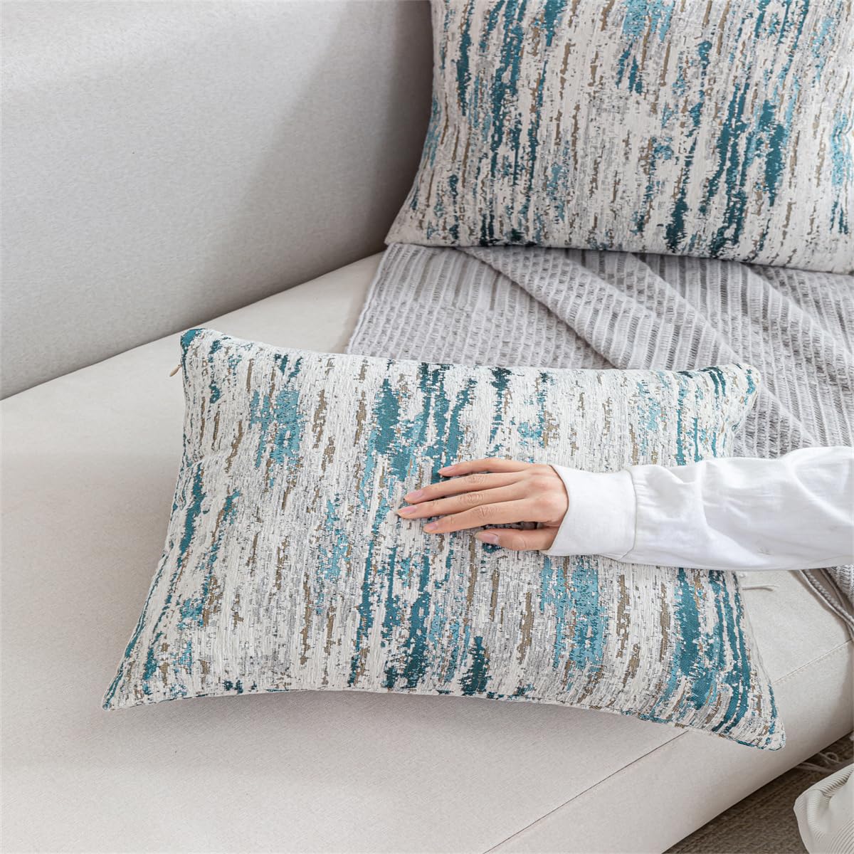 AGOKABA chenille texture pillow cover showcases teal ombre accents on living room seating.
