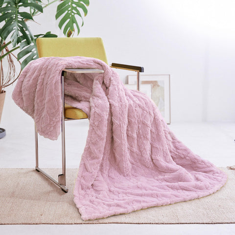 Aheadpret pink heated blanket tucked in bed for pre-warmth