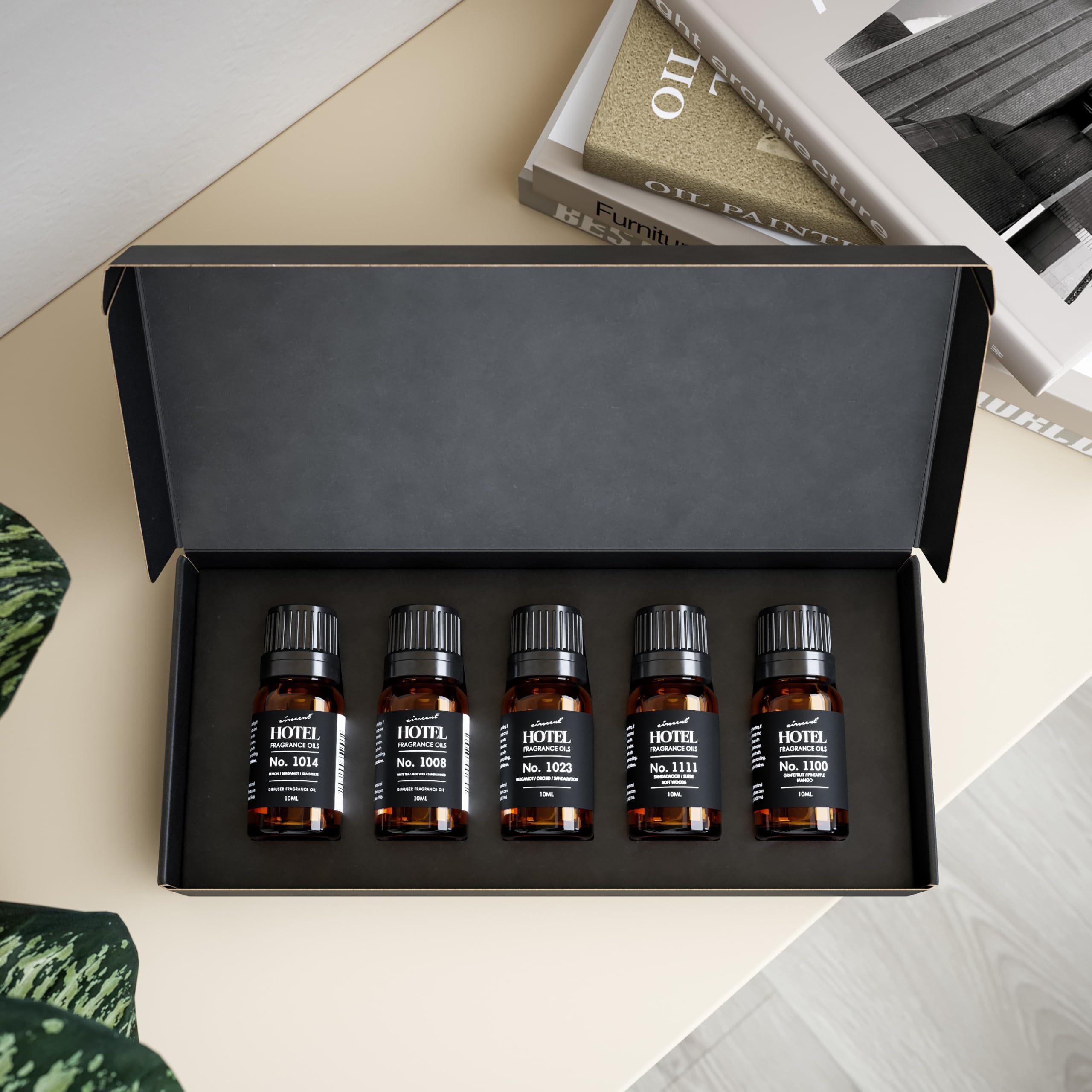 Air-Scent diffuser oil bottle closeup showcases hotel-inspired scents.