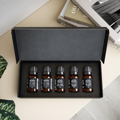 Air-Scent diffuser oil bottle closeup showcases hotel-inspired scents.