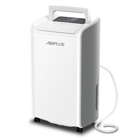 AirPlus dehumidifier installed in a basement with a drain hose for continuous operation.
