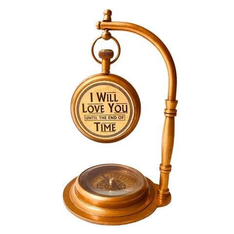 ALADEAN brass table clock with compass base detail, showcases sturdy construction.
