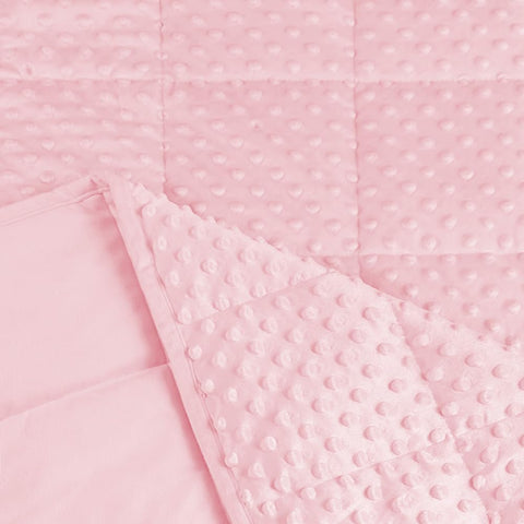 ALANSMA neatly folded pink weighted blanket showing compact storage and display.