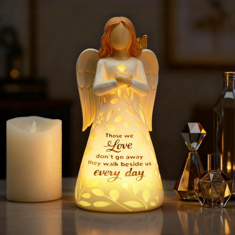 AlevaHive remembrance angel with intricate branches adds serene ambiance.