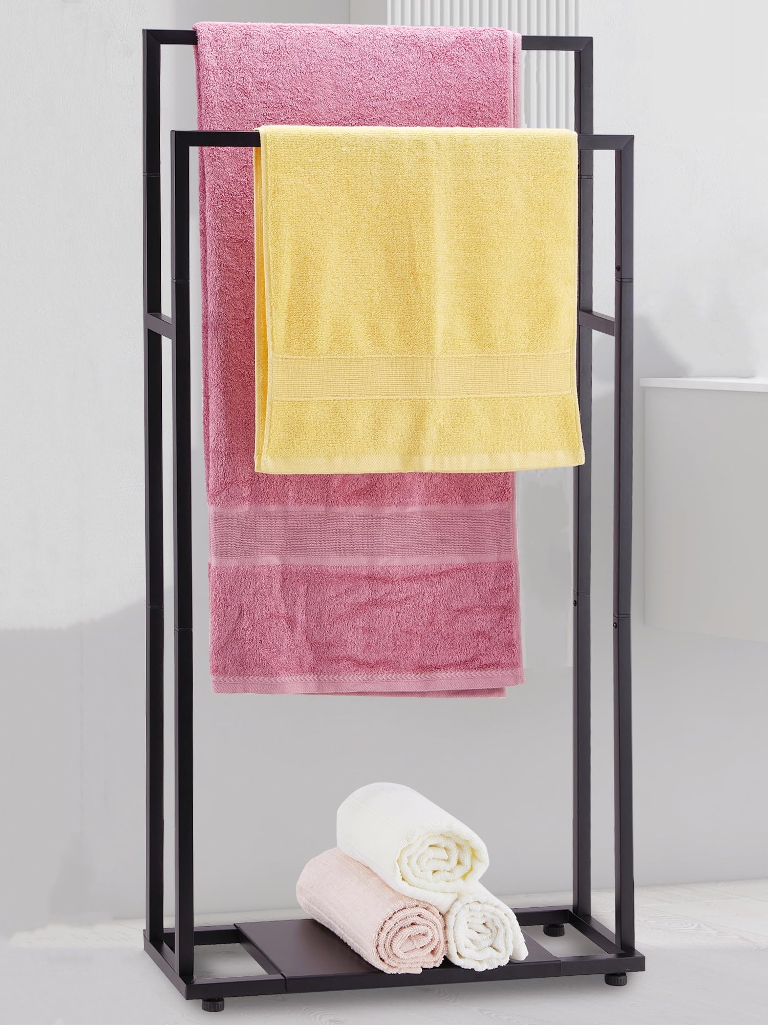 ALHAKIN 39'' tall towel rack stand in black keeps oversized towels off the floor.