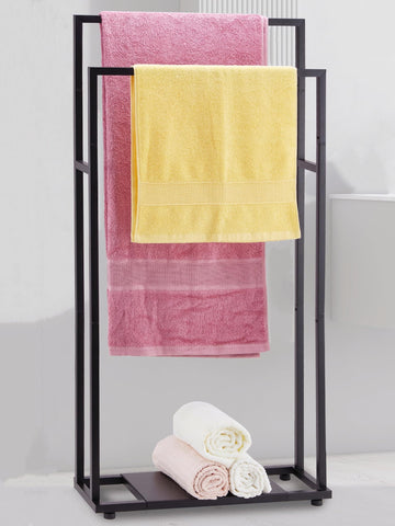 ALHAKIN 39'' tall towel rack stand in black keeps oversized towels off the floor.