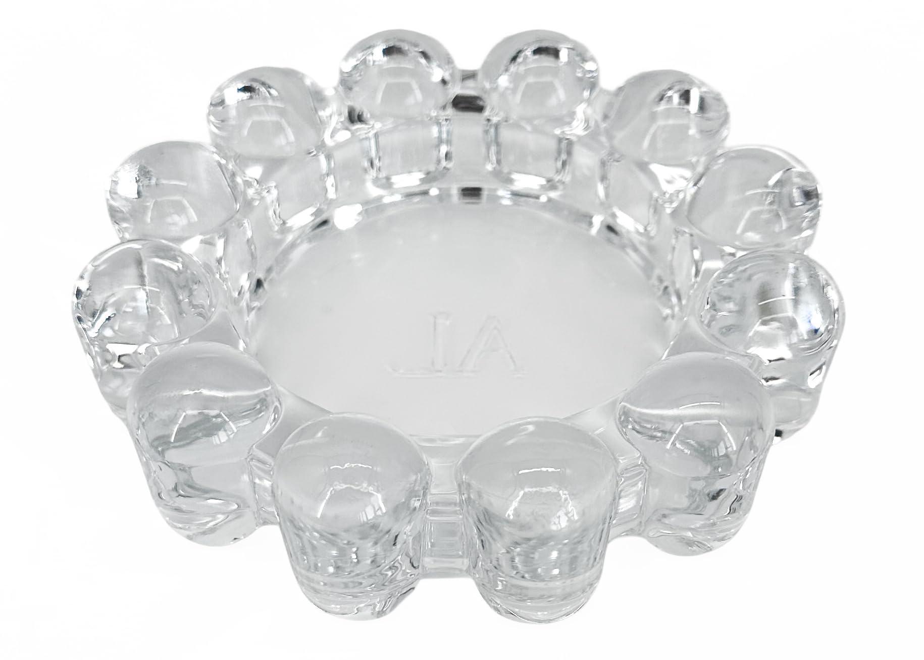 Alice Lane bubble dish silhouette showcases a sculptural glass accent for small candles.