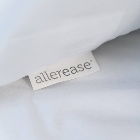 AllerEase pillow protector in wash cycle showing hot-water wash capability