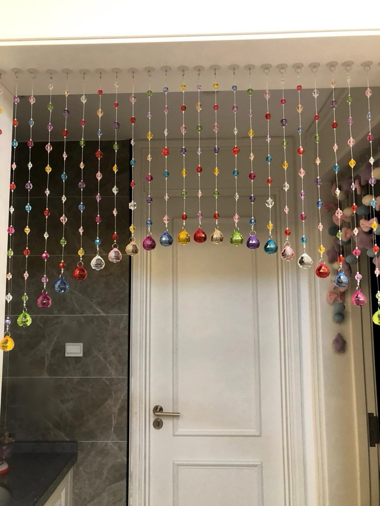 Alpengulen crystal beaded curtain with multicolor rainbow beads drapes gracefully as a doorway accent