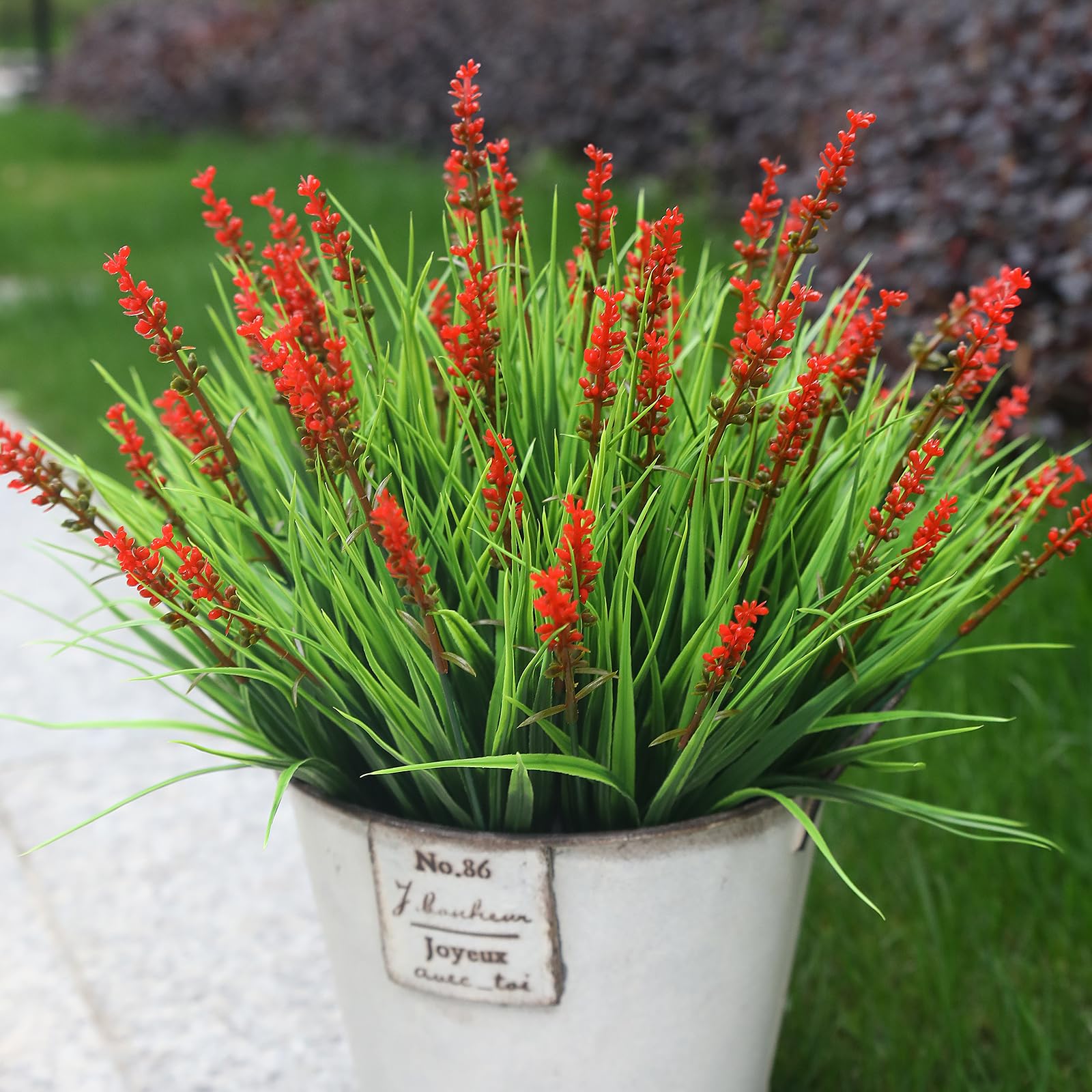 Alyptus garden-path display using red bundles for color and texture