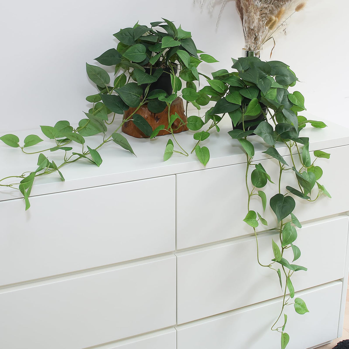 Alyptus fake pothos hanging plants with pots on a shelf adds lush greenery to shelves.