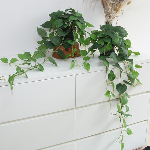 Alyptus fake pothos hanging plants with pots on a shelf adds lush greenery to shelves.