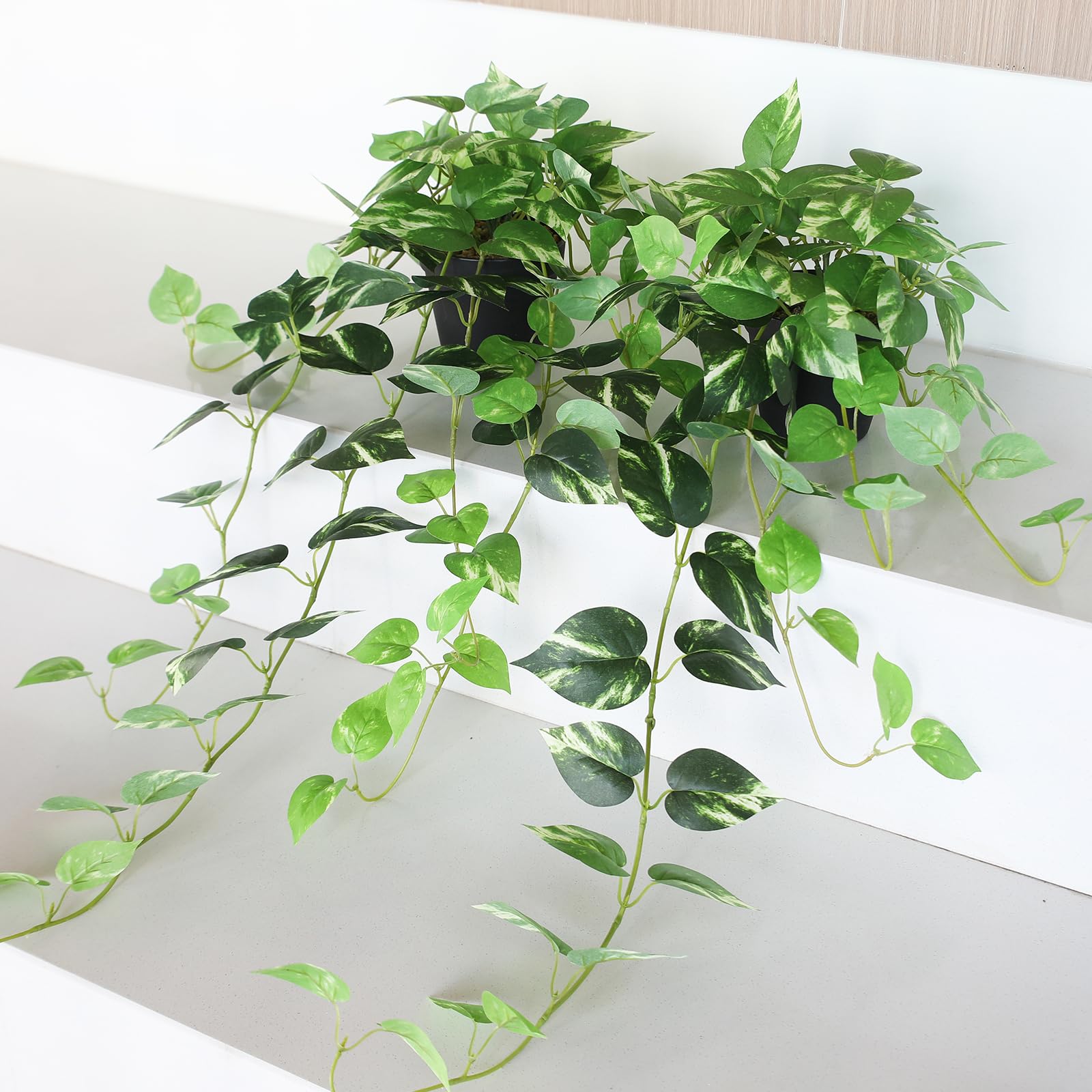 Alyptus layered greenery look pairs with other faux plants
