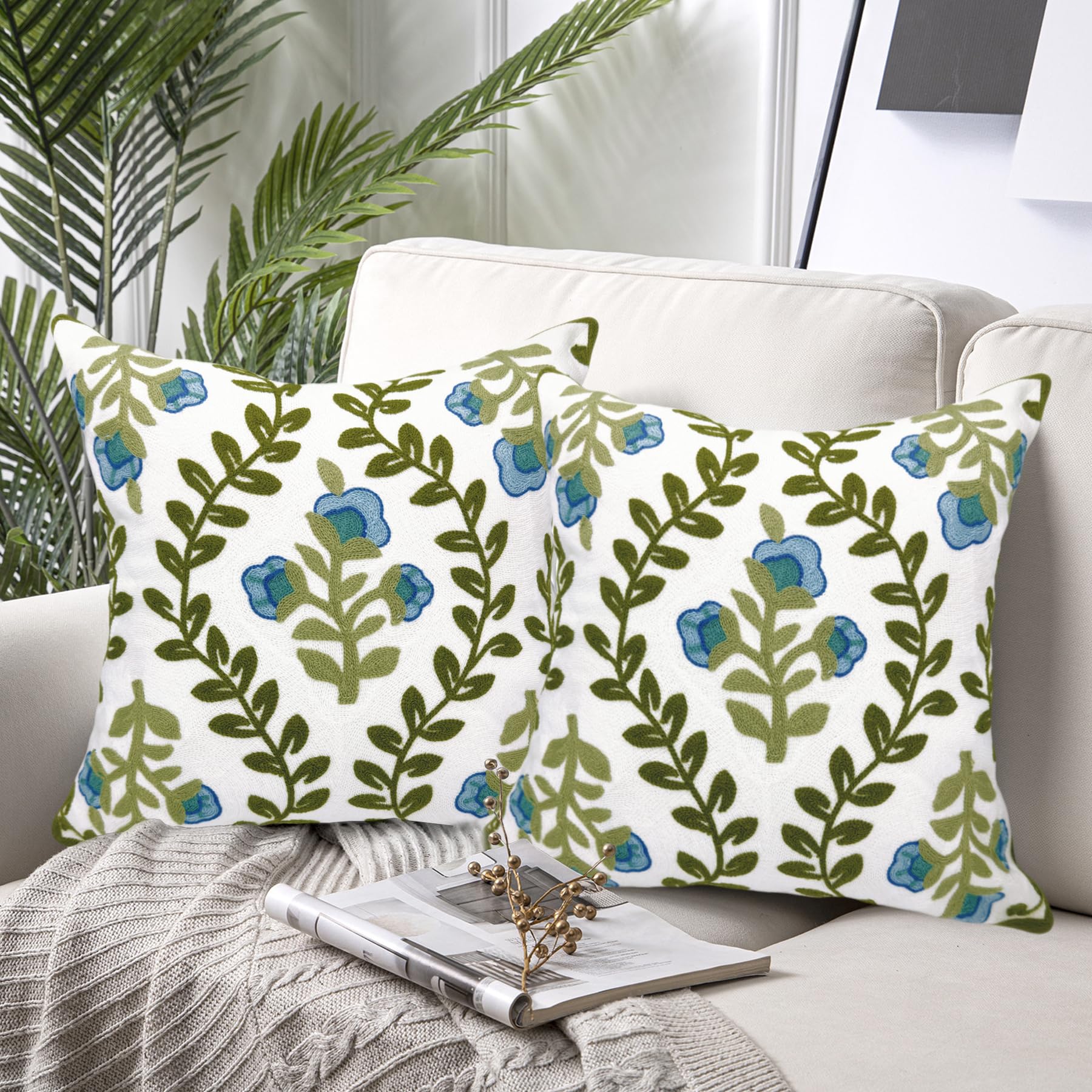 Close-up of Alysheer blue flowers embroidery showing precise stitching.