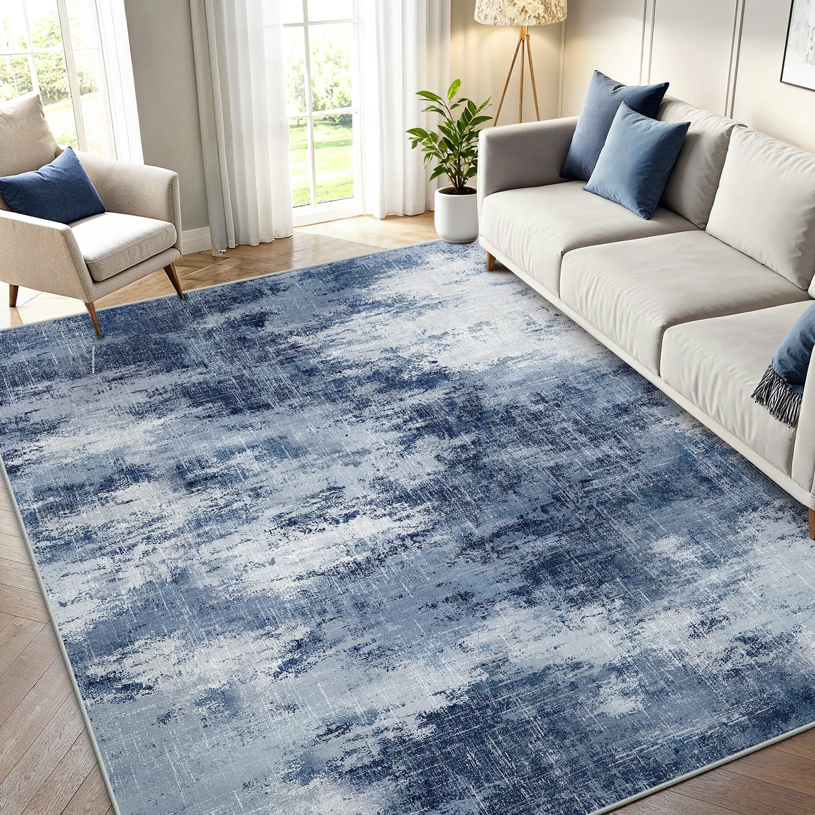 AMADA HOMEFURNISHING 5x7 rug with abstract pattern enhances living space.