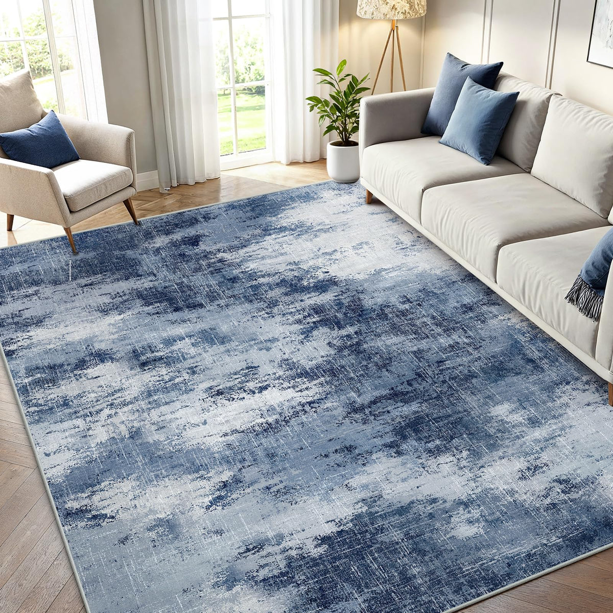 AMADA HOMEFURNISHING 5x7 rug with abstract pattern enhances living space.