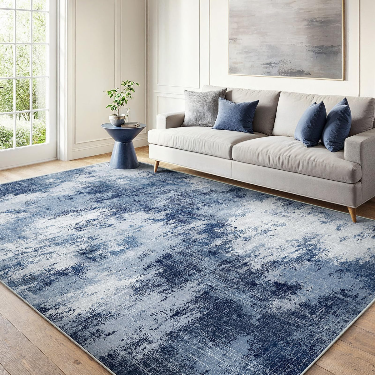 AMADA HOMEFURNISHING 6x9 rug with abstract pattern enhances living room aesthetics.
