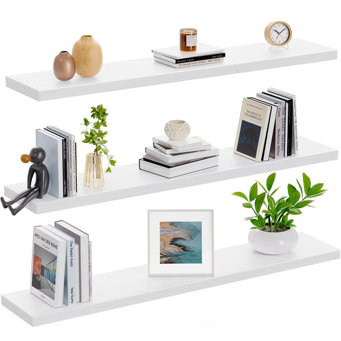AMADA HOMEFURNISHING white floating shelves on plain wall with soft lighting.