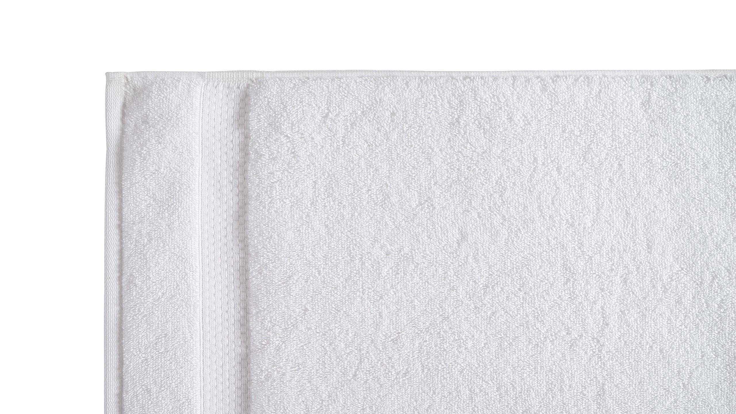 Amazon Basics bath towels 27x54 white texture close-up highlighting quick-dry performance.