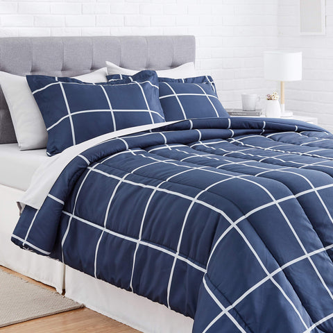 Amazon Basics bed-in-a-bag displayed in a dorm room setup