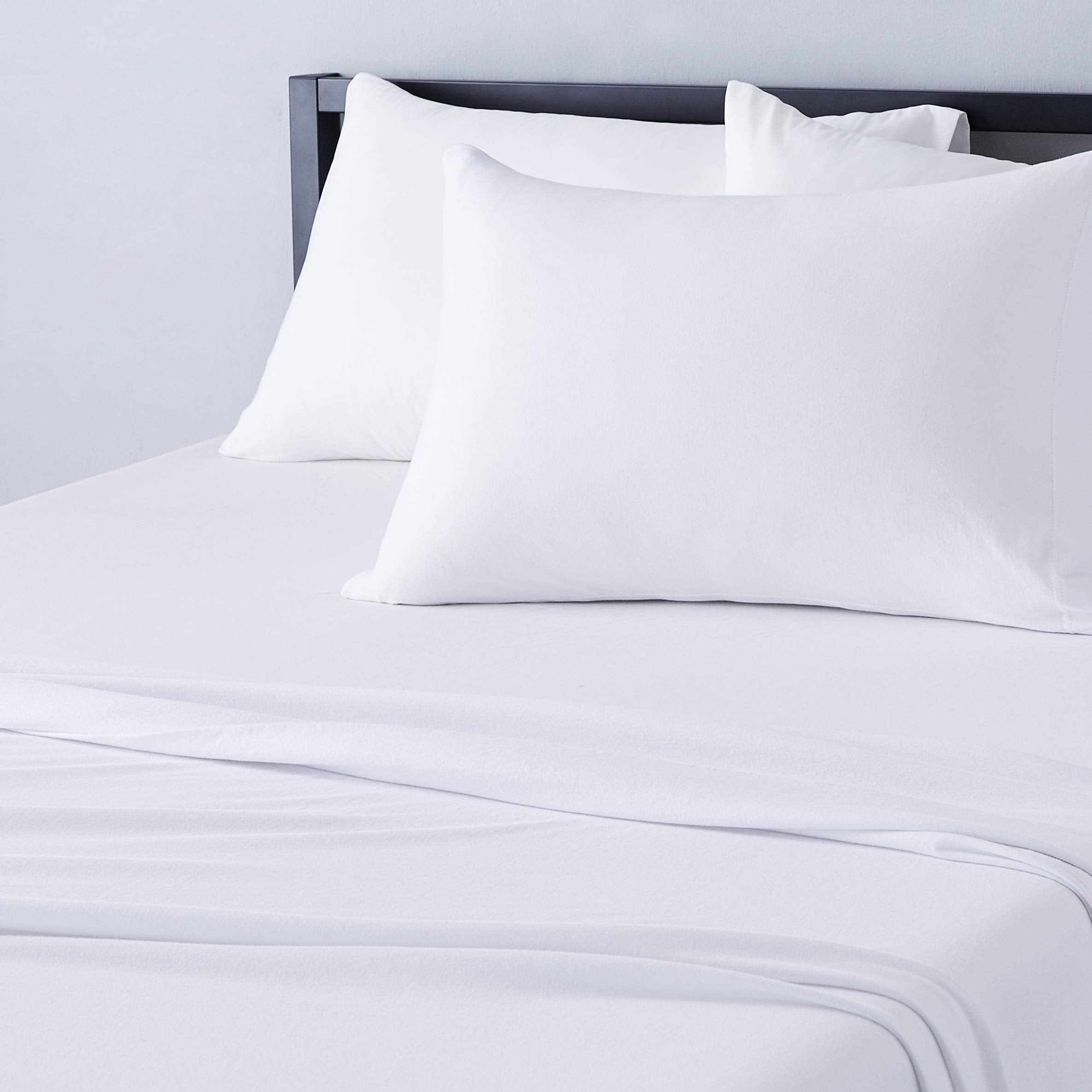 Amazon Basics breathable jersey twin sheet on bed showing soft fabric and comfort