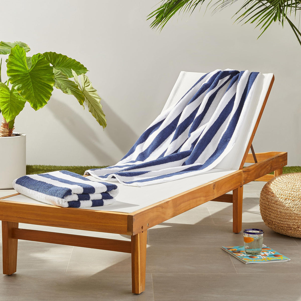 Amazon Basics cabana stripe beach towel on sand for quick drying after a swim