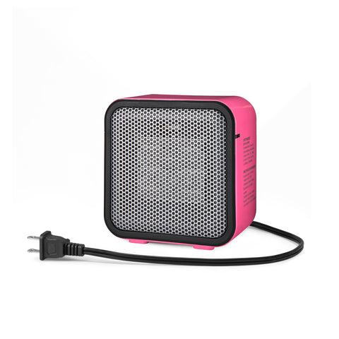 Amazon Basics ceramic space heater on a desk showing compact design for small spaces